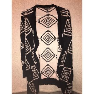 Black cardigan with white diamond pattern